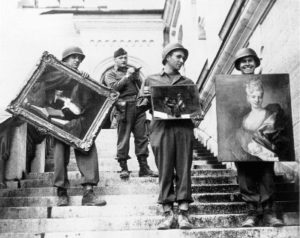 MFAA Officer James Rorimer supervises U.S. soldiers recovering looted paintings from Neuschwanstein Castle (Photo credit: NARA / Public Domain)